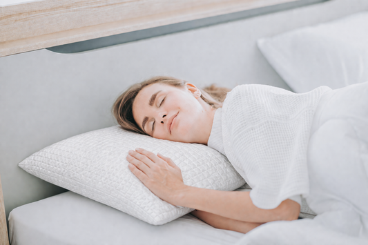 Woman sleeping on a cooling pillow looking peaceful 