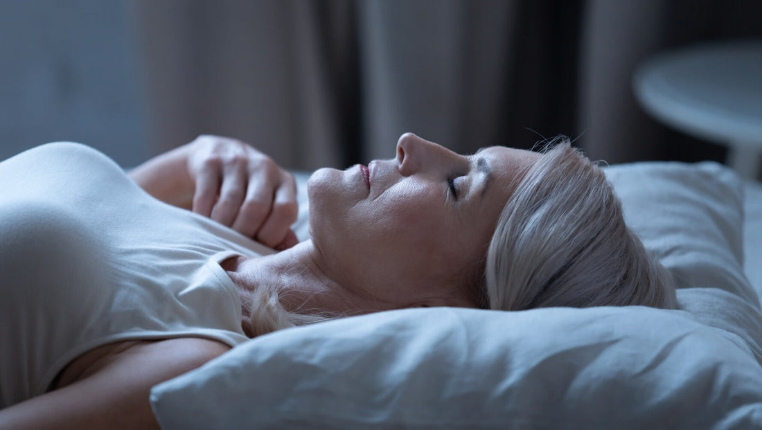 Woman sleeping on here back looking calm and sleeping deep
